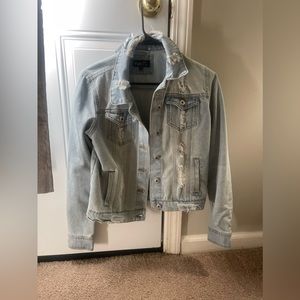 Jean jacket with holes